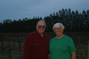 Ripken Wine family members, older couple standing in a vineyard smiling.