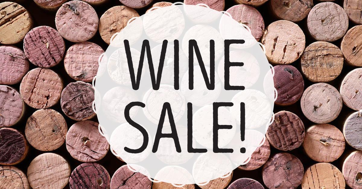 Wine Sale graphic. Wine cork texture in the background.